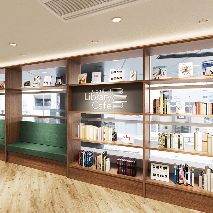 【フロント前】ライブラリーカフェへと続く本棚が印象的な空間