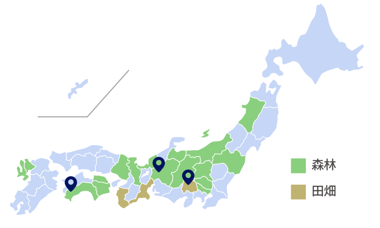 日本地図に森林と田畑の分布を示す色分けがされ、森林は緑、田畑は茶色で塗られている。三か所にピンが立てられている。